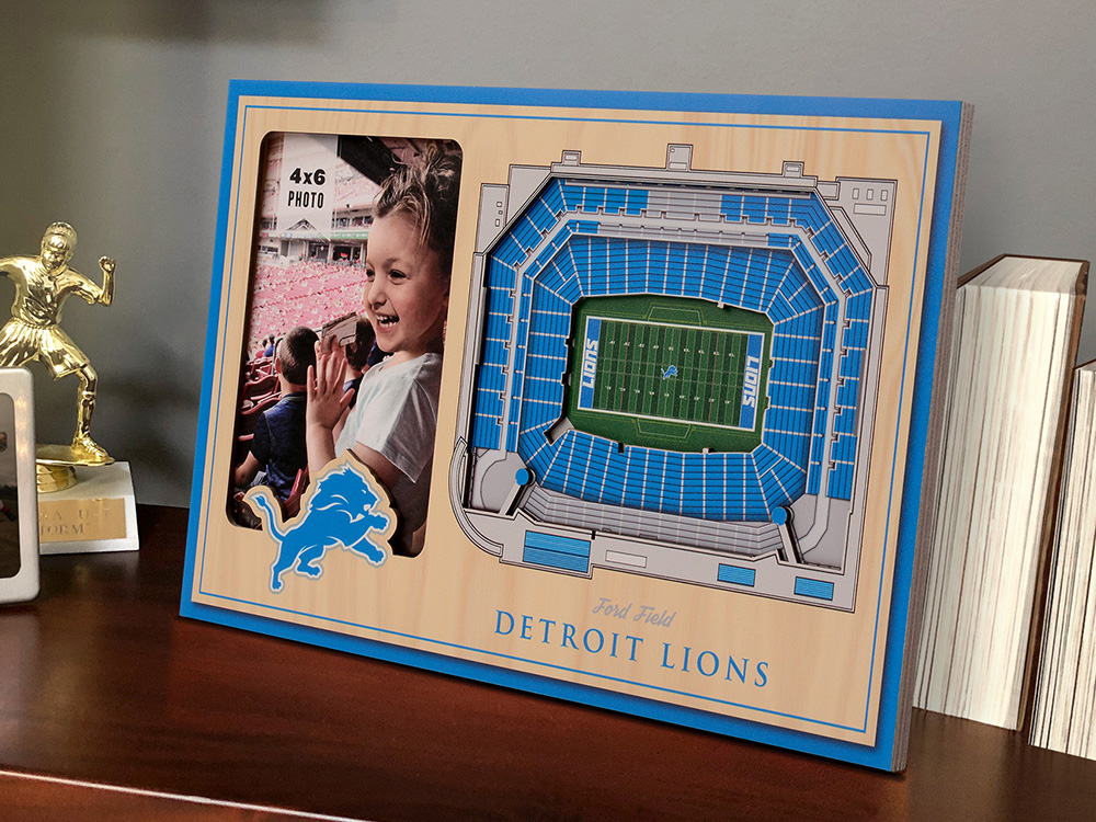A photo of a little girl at a stadium sits framed in a Detroit Lions 3D stadium picture frame from StadiumViews