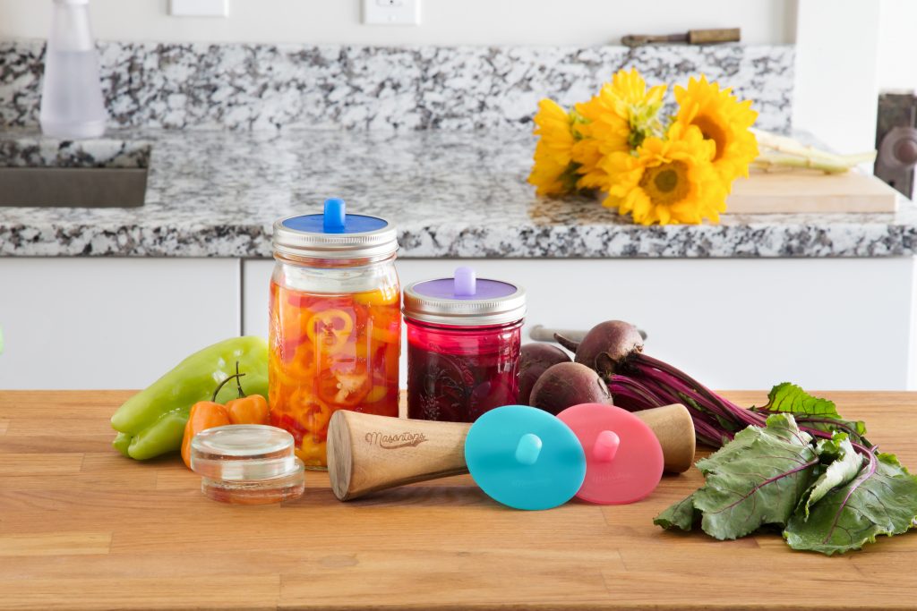 Beets and peppers sit on a counter next to Masontops' fermentation kit