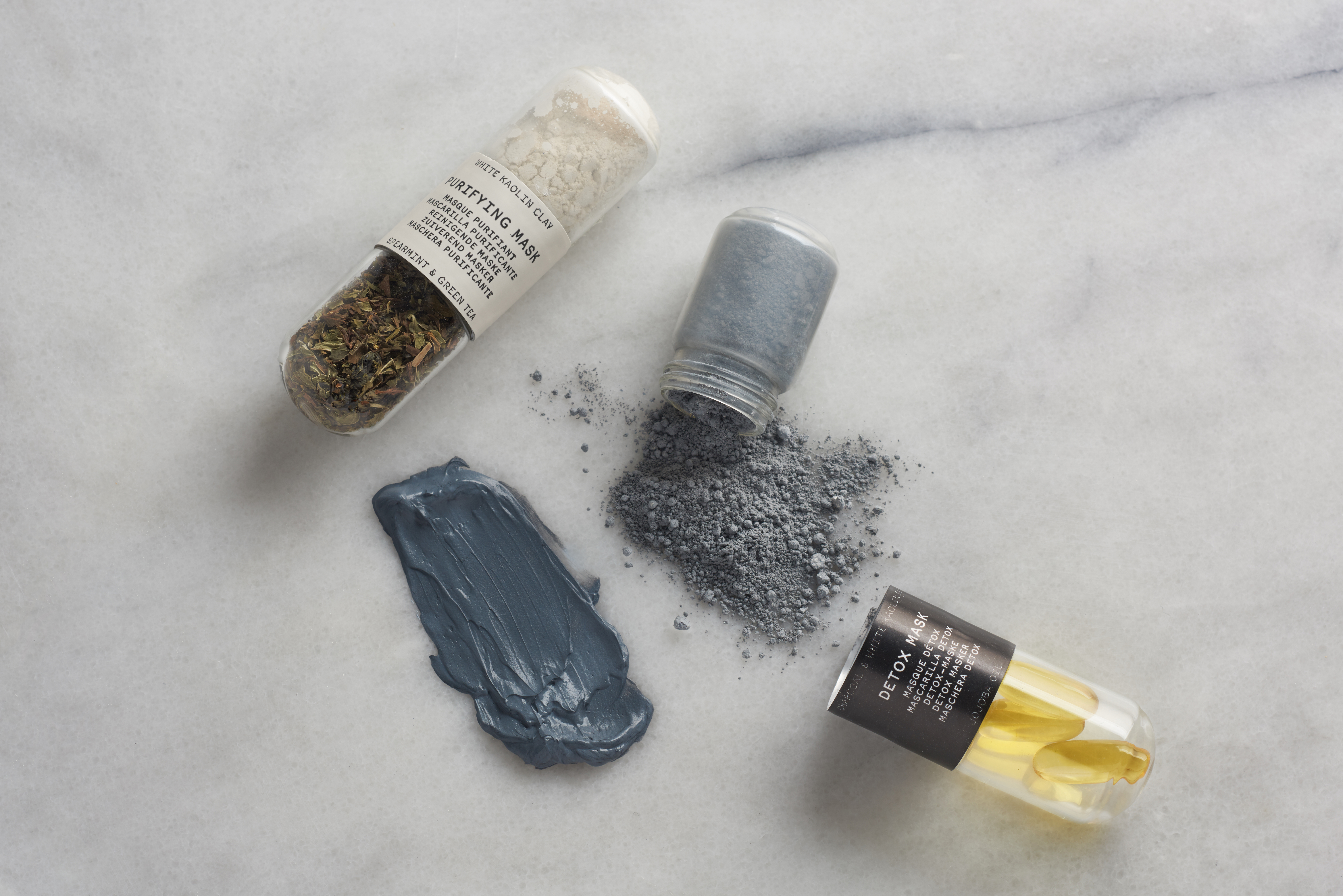 Capsules of Oleum Vera's DIY face mask kits sit on a counter