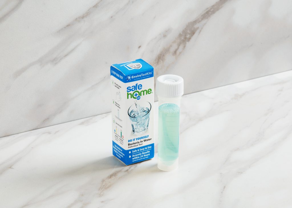 A test tube of water is being tested for coliform & E. Coli using Safe Home's bacteria test kit