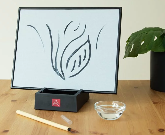 A watercolor drawing is seen on a Buddha Board