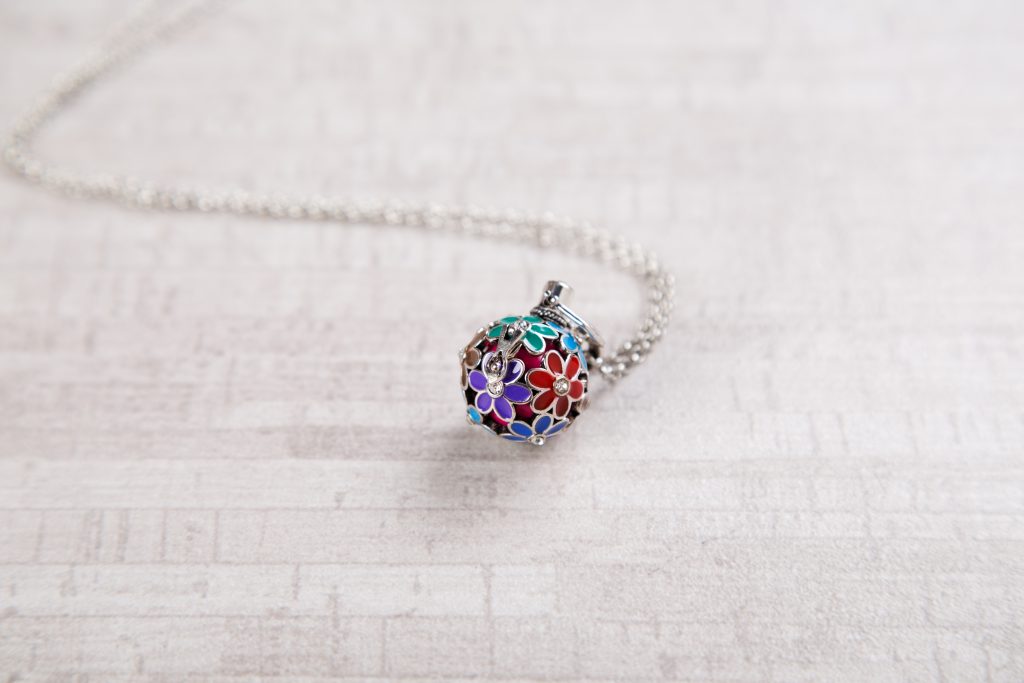A multi-colored angel locket from Yourself Expression