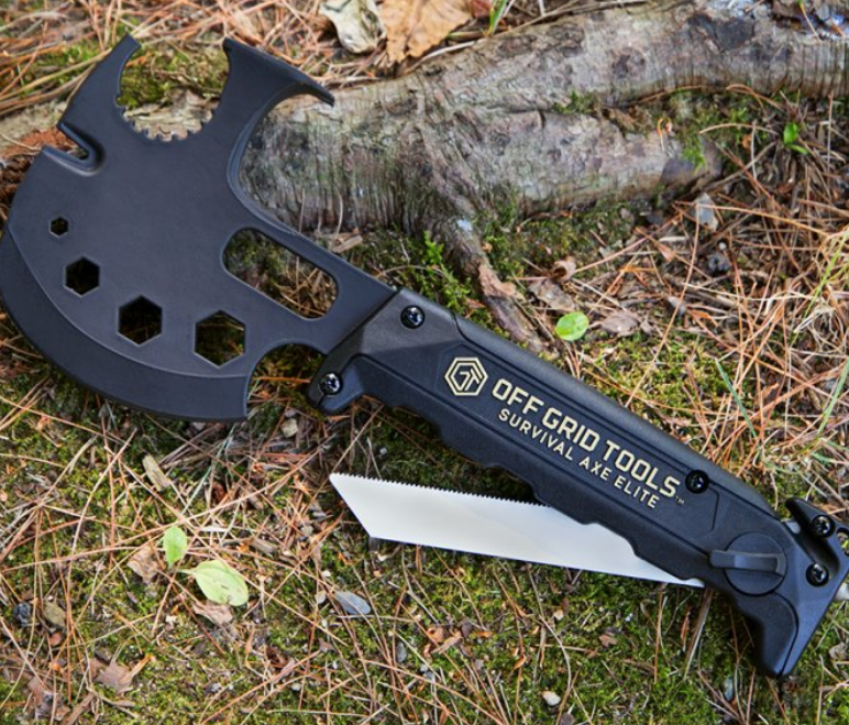 A black Survival Axe from Innovation Factory sits on the ground